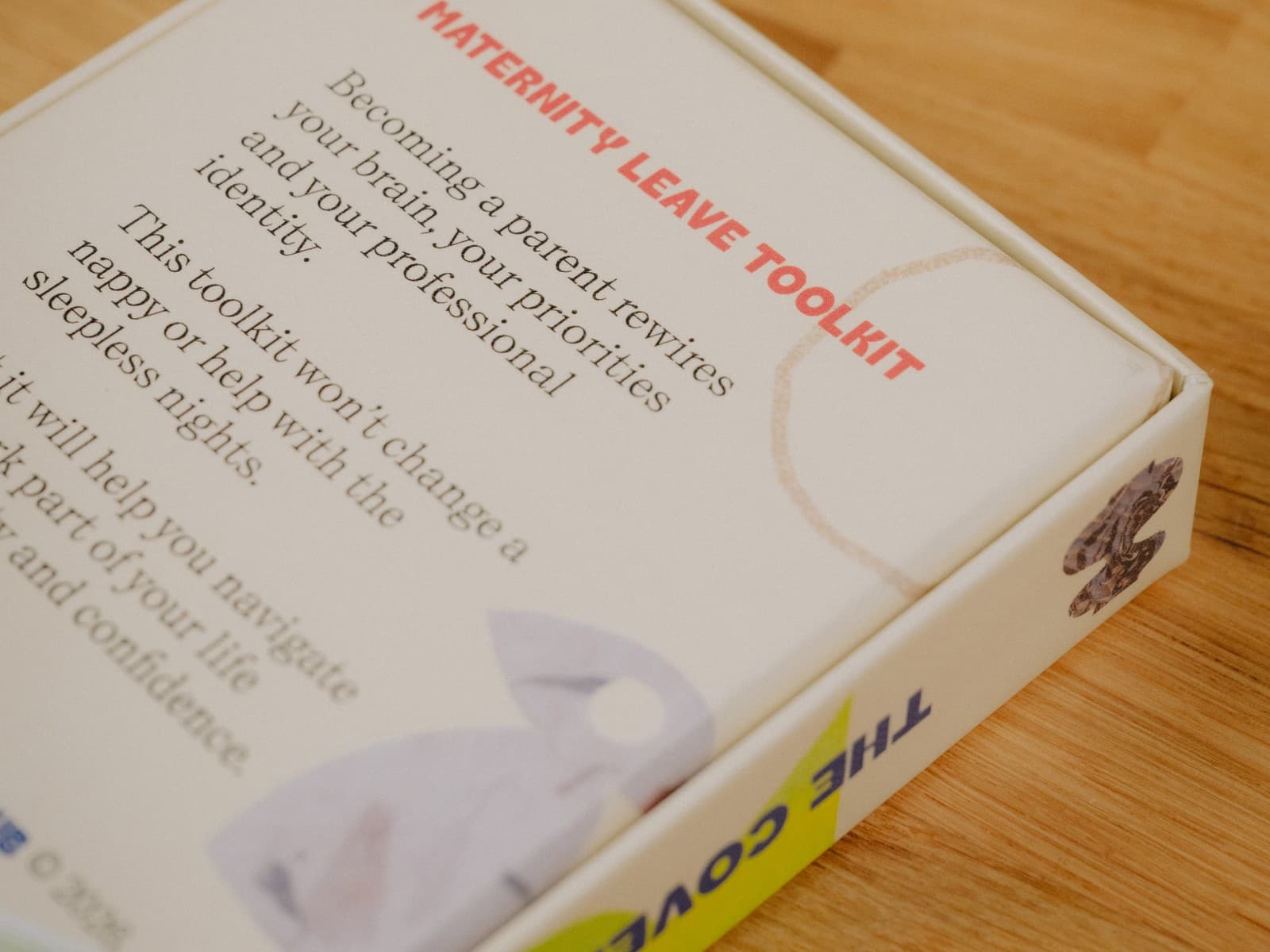 The Cover Club maternity leave toolkit box on a desk