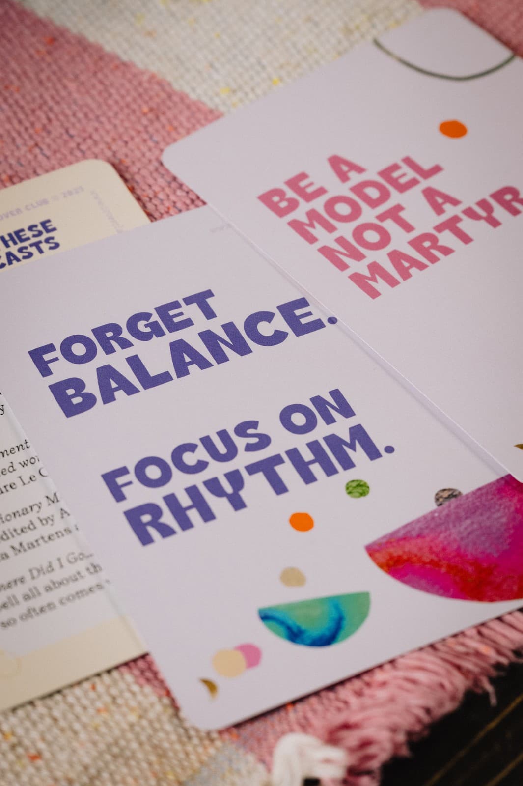 A Cover Club booklet open to a page reading forget balance, focus on rhythm