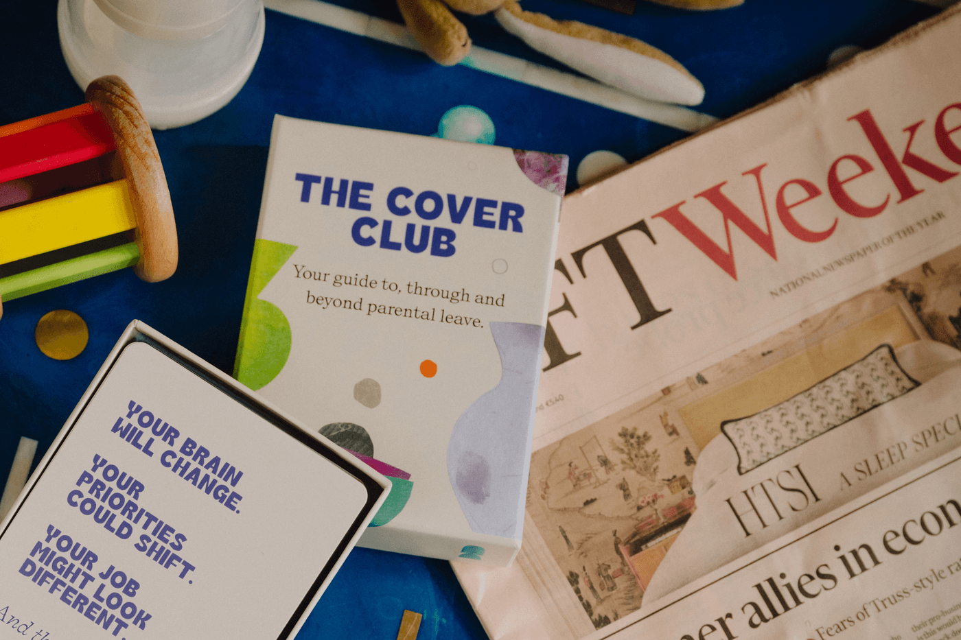The Cover Club guide and cards laid out on a table