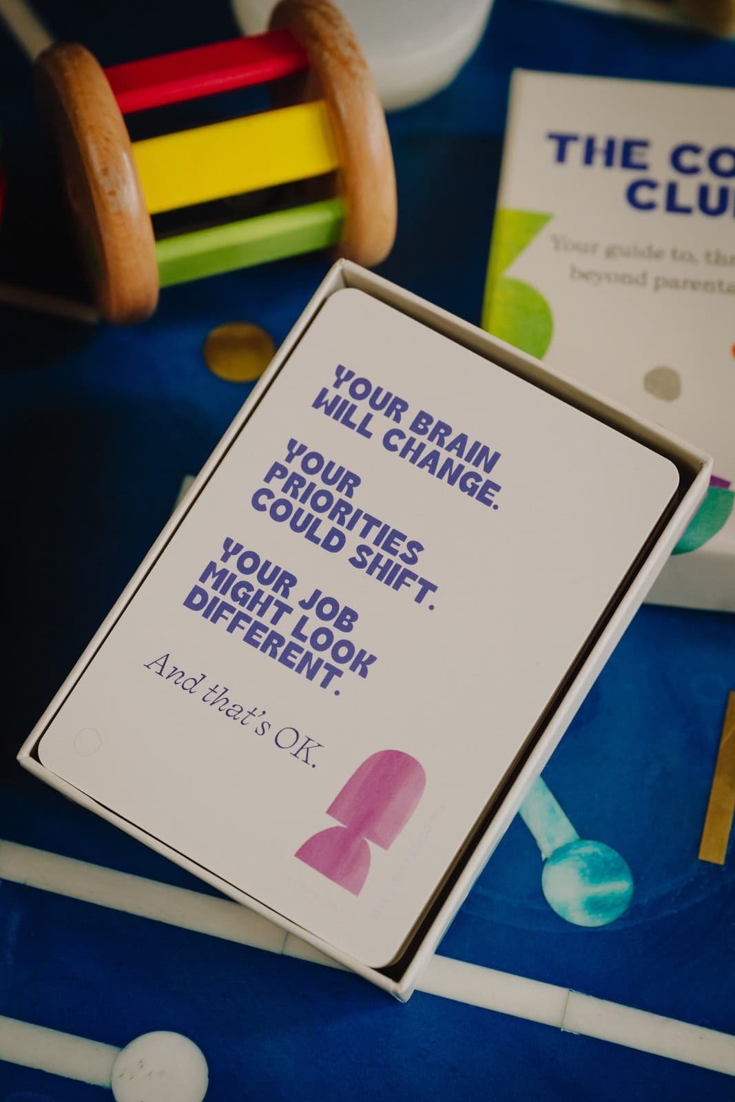 The Cover Kit box open showing a card that reads your brain will change, your priorities could shift, your job might look different, and that's OK